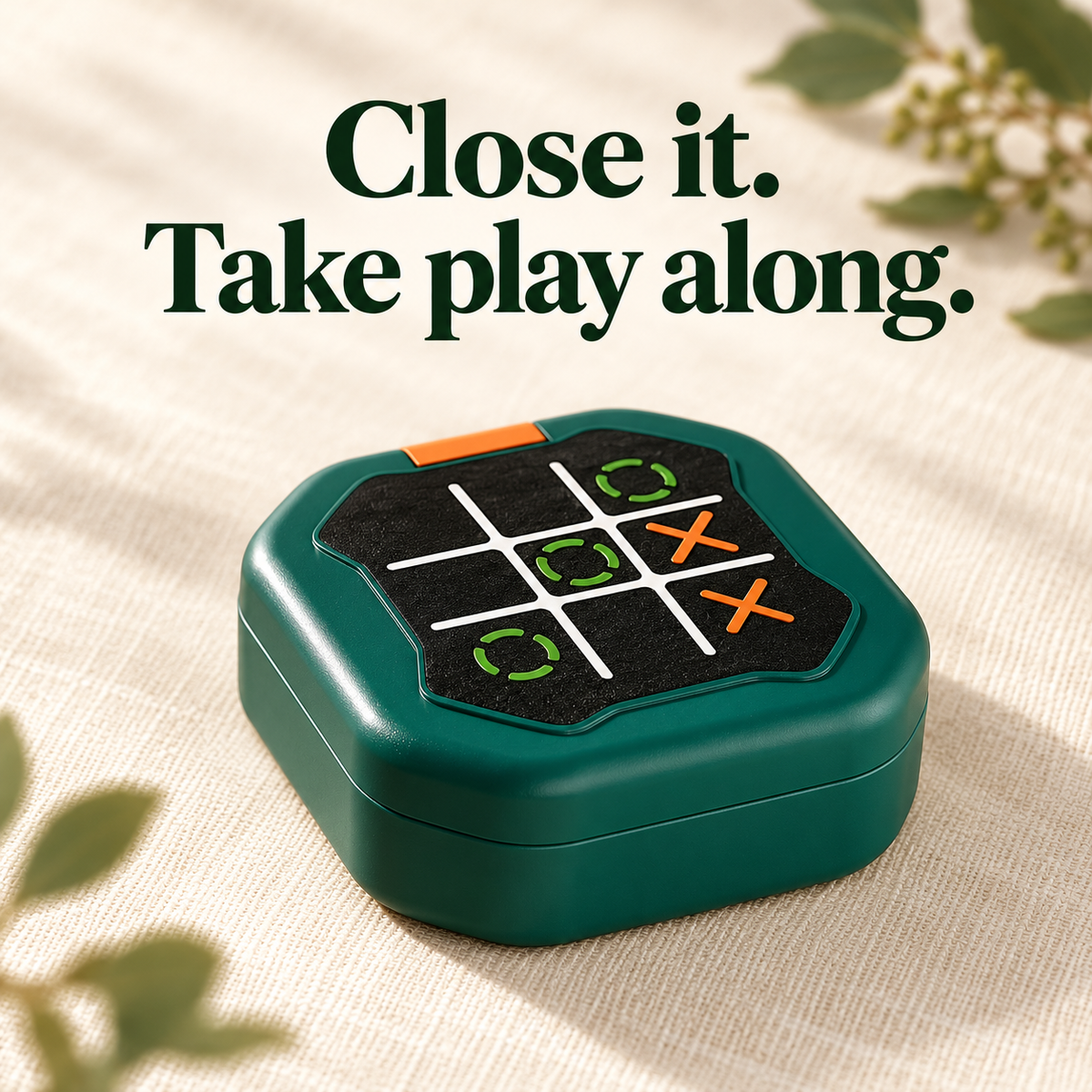 One dark-green electronic tic-tac-toe game closed in its clamshell case.