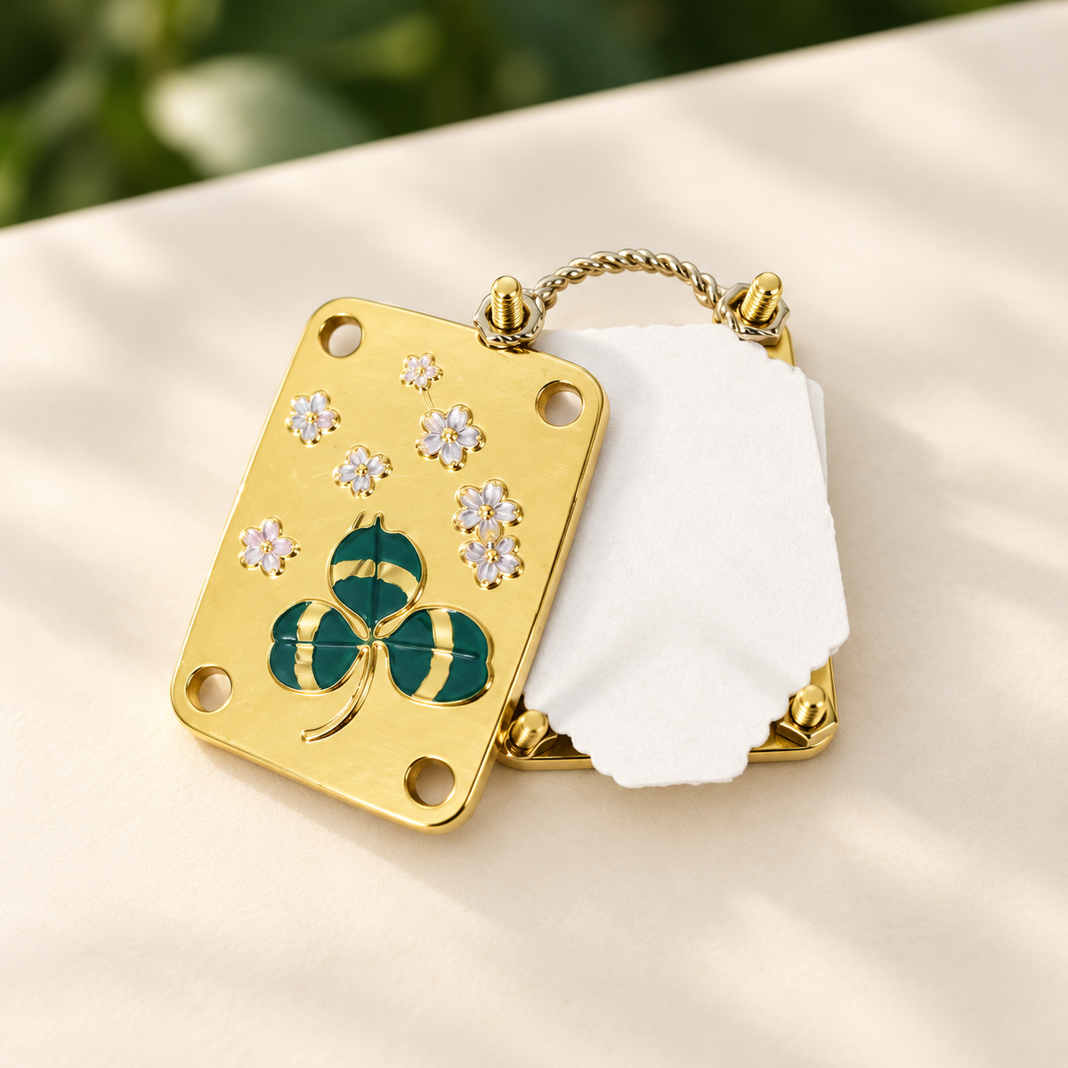 Mini Clover metal flower press with the plates, papers and four corner fasteners separated