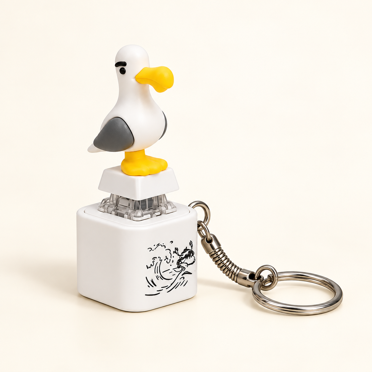 One white seagull keychain with grey wings, yellow beak and feet, clear press-style switch, white base and metal key ring