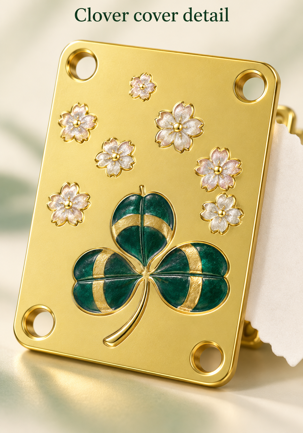 Green clover and small flowers decorate the gold-coloured metal cover