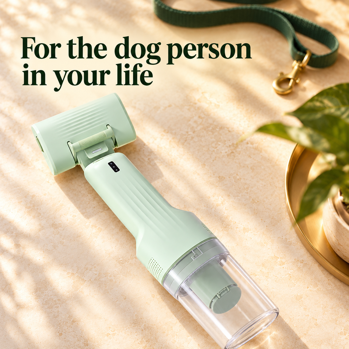 Green CA20 grooming vacuum styled as a dog-owner gift idea; decorative lead excluded