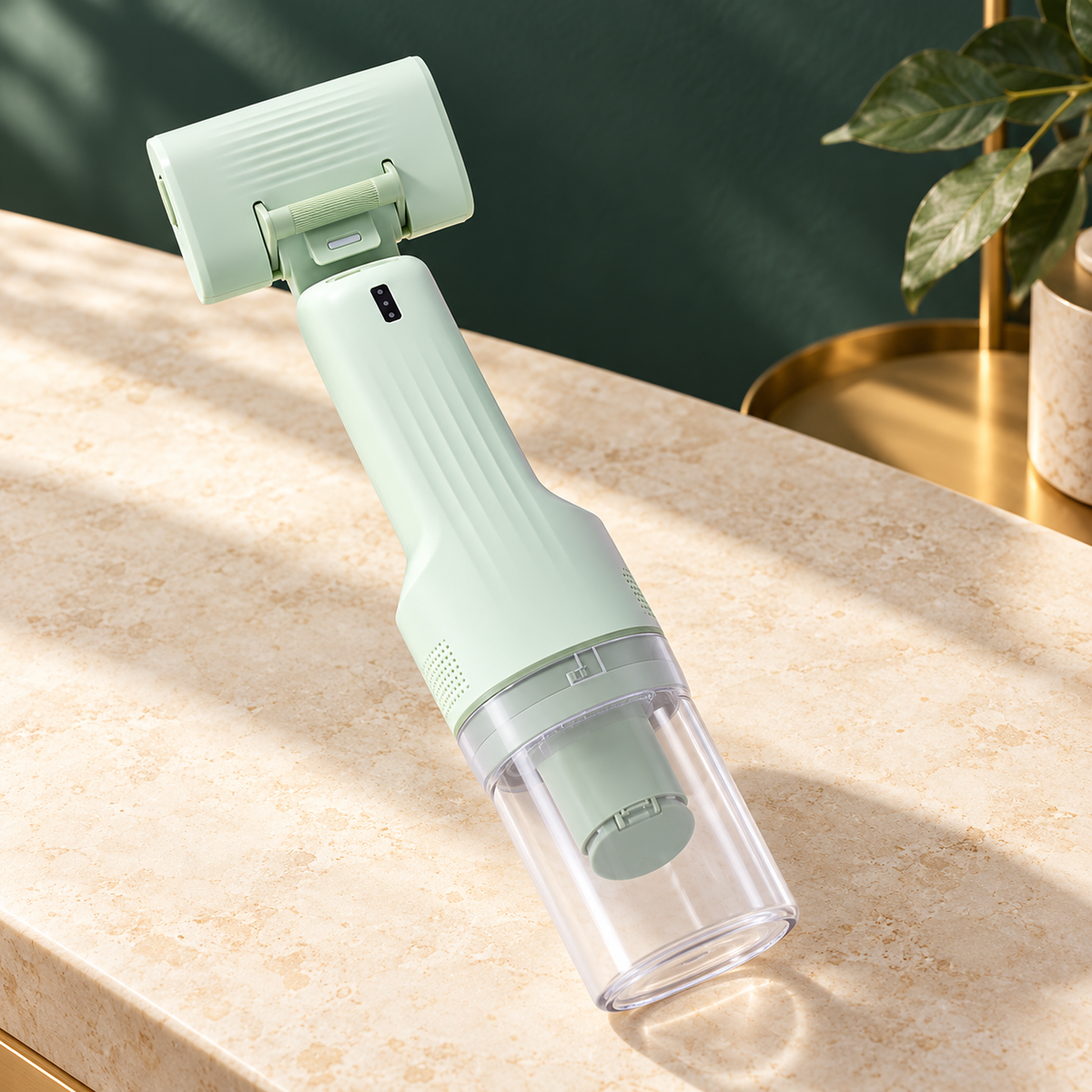 Green CA20 handheld grooming vacuum with its comb head attached